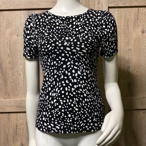Express brand top with slight puff sleeve white on black splotch pattern NWT